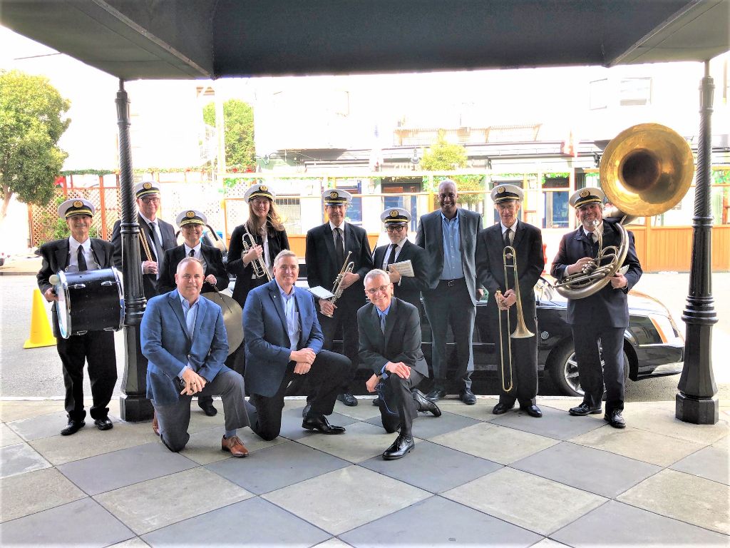Green Street Memorial Band (formerly Green Street Mortuary Band) group portrait showing band members in formal attire with their instruments for Chinese and Vietnamese funeral ceremonies