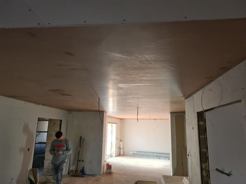 Interior ceiling with worker showing the process